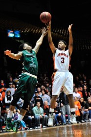 Melvin Morgan, 3, tries to shoot around a Portland State player Saturday, March 9.
