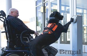 Annie pushes the handicap access button for Michael Riley.