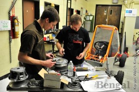 Engineering students work on their Baja car project.