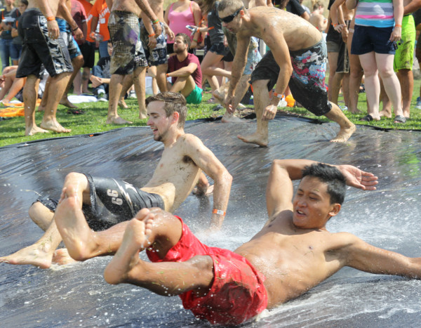 Students enjoys Slip N' Slide on Bartz Field Saturday Aug. 24 