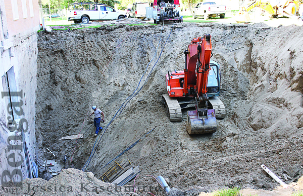 A large hole is visible outside the  Business Administration building.