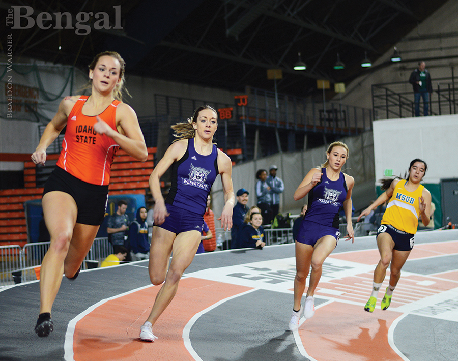 Women running on track.