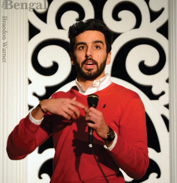 Student speaking into microphone.