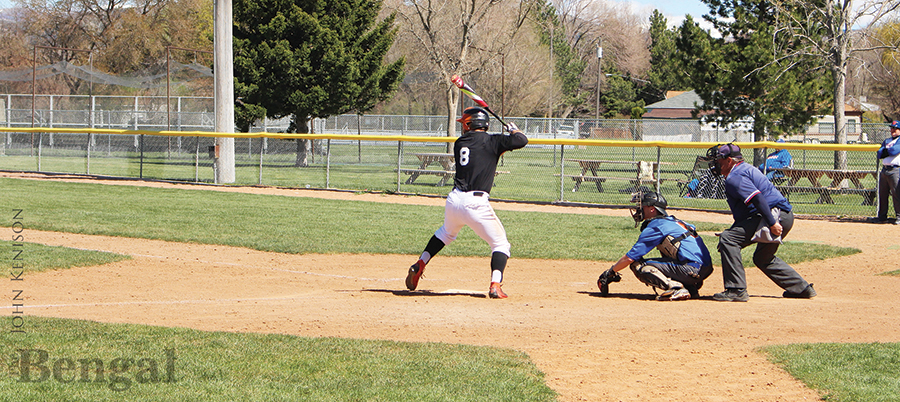Hitter and catcher on the pitch during a baseball game.