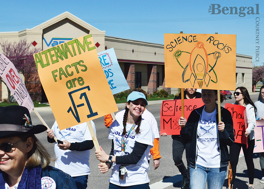 People holding posters at Science March.