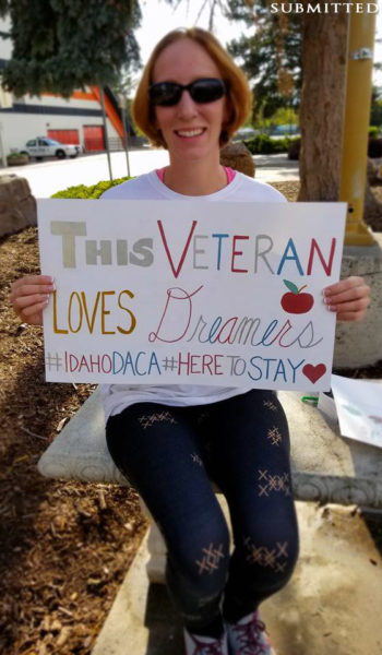 DACA supporter holding poster.