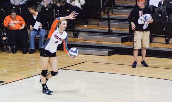 Garrity serves the ball