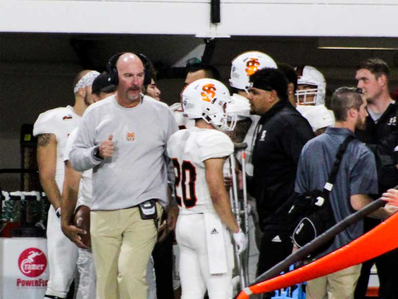 ISU football team and coach