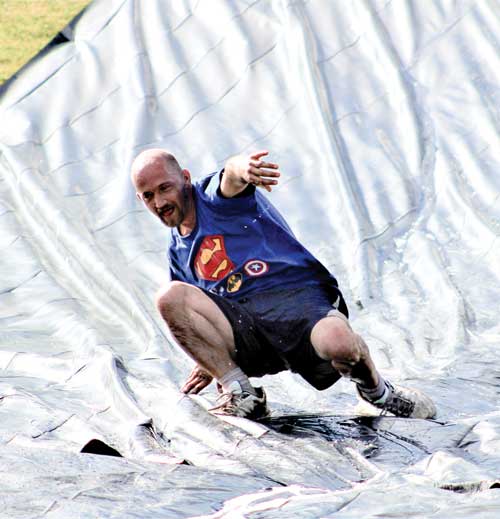 ISU Ambush man sliding down tarp