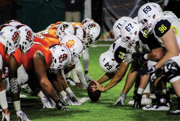 ISU and NAU players face off on the line of scrimage.
