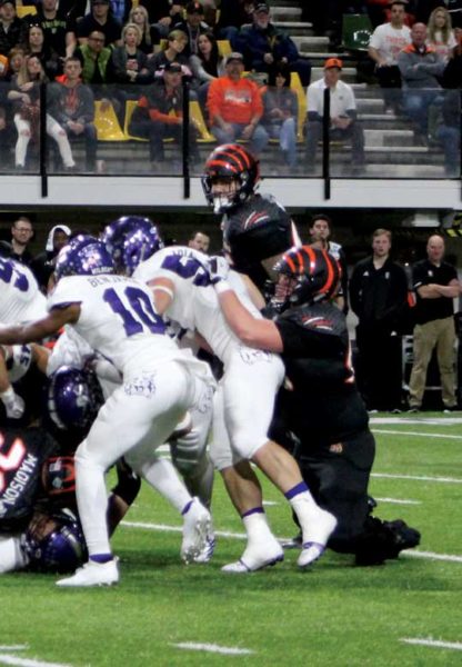 ISU players and opposing players pile up