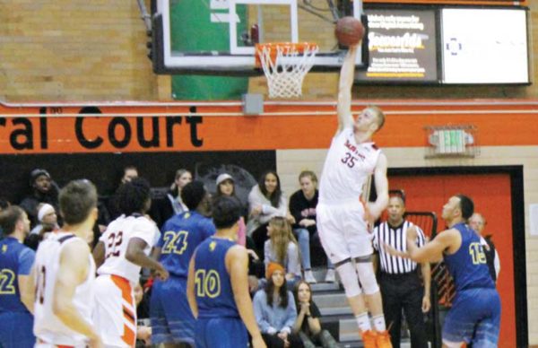 Kelvin Jones (35) dunks against Bethesda. 