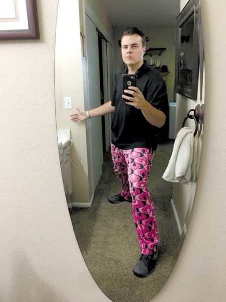 John Bolliger poses in front of mirror.