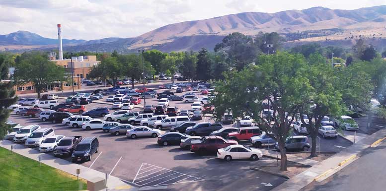 Parking lot outside of PSUB, full of cars