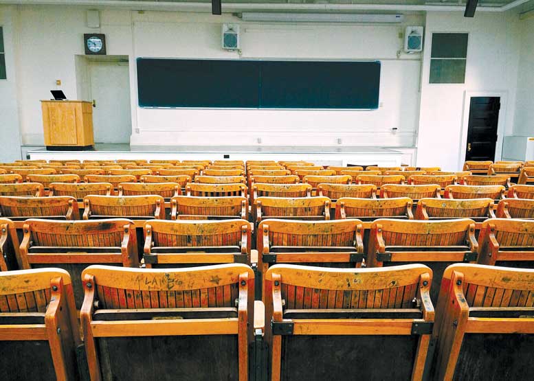 Wooden desk in a lecture room.