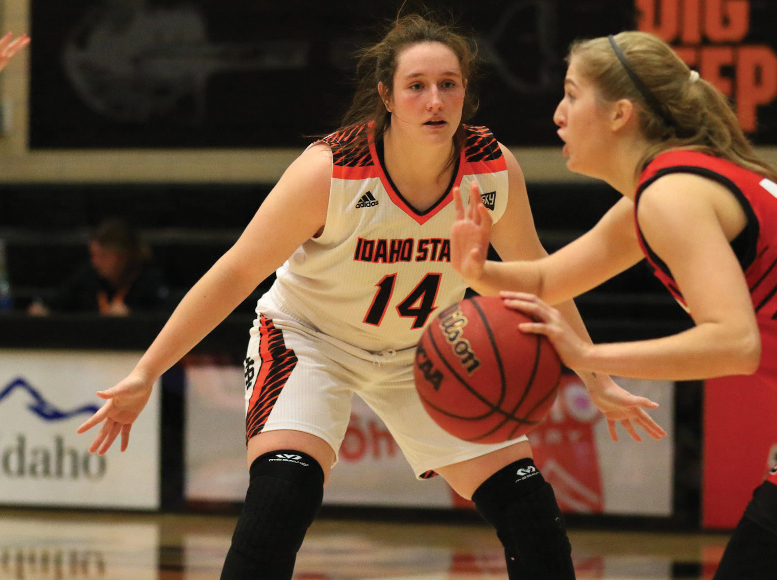 Estefania Ors plays defense on another female player dribbling the ball.