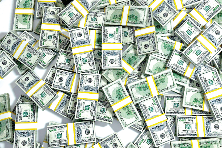 Bundles of 100 dollar bills lay scattered.