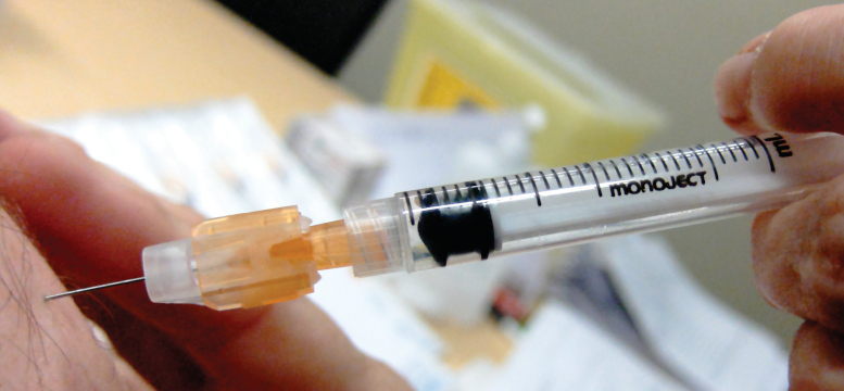 Closeup of soeone getting a vaccine