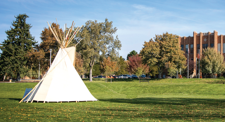 Photo of a tipi set up on the Quad across from the Administration building.