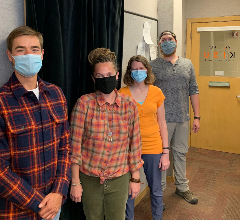 Featured: Scott Greeves, Rhesa Ledbetter, Jessica Whitaker and Christian Powell, stand in a line, with masks on.
