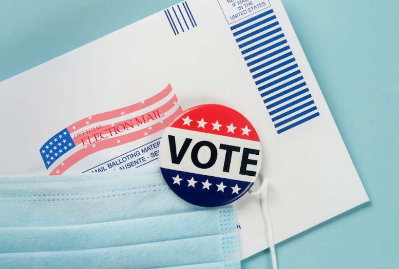 Voting envelope, mask, and vote badge.