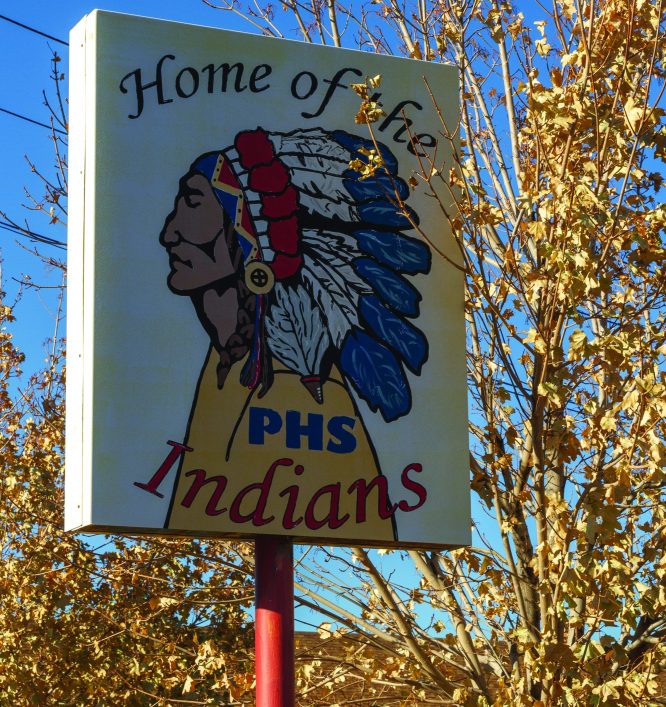 Sign reading "Home of the PHS Indians" wuth a Native American profile.