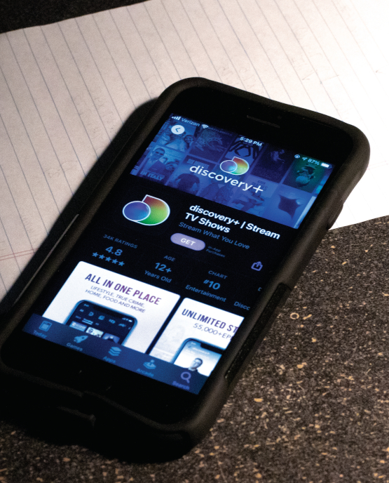 Cell phone with Discover+ app open