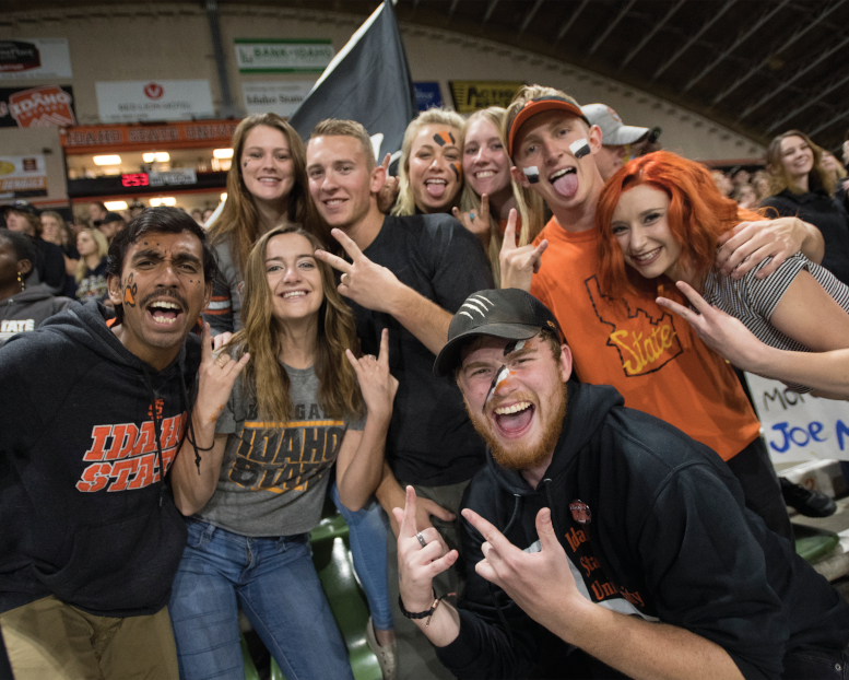 Group of students gressed in ISU gear pose for camera