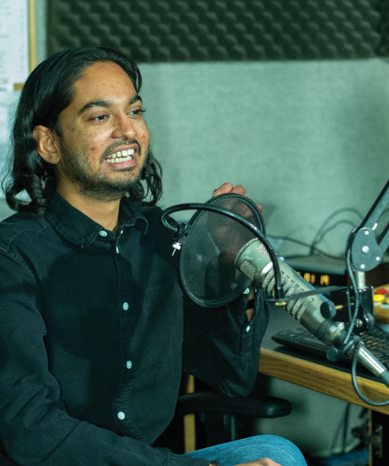 Krystoff Krisson speaking into microphone