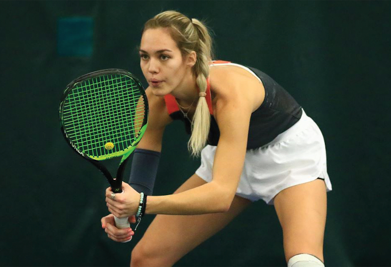 Hristina Cvetkovic holds tennis racket
