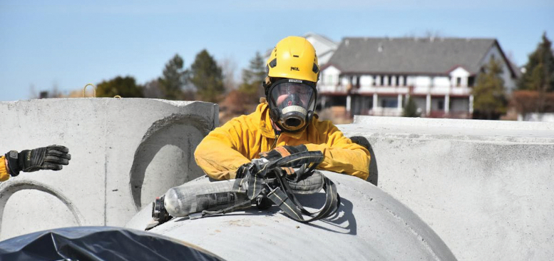 Person in yellow hazard suit