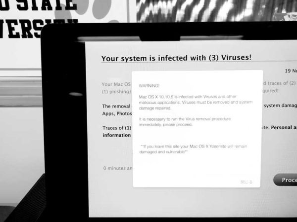 Computer with virus popup on screen